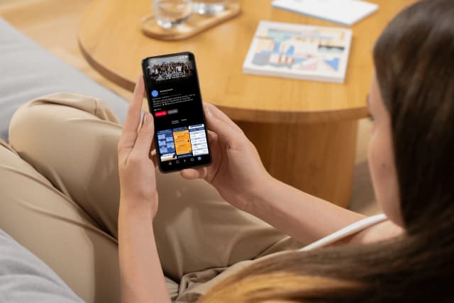 Person browsing the Knowcrunch Pinterest profile on a smartphone.